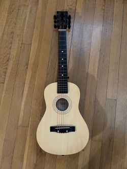Toy guitar, properly tuned