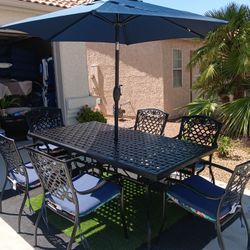 Patio Set Heavy Metal Table And 6 Chairs With New Cushions And New Umbrela 
