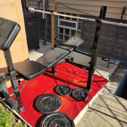 MARCY. BENCH WITH 126LBs  OF 1" HOLE PLATES. 
 2-50s. 2-13.2s.  
6' STRAIGHT BAR WITH COLLARS 
11525 S HALSTED DUNKIN DONUTS/ 7111.S WESTERN WALGREENS