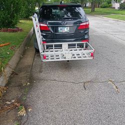 A wheelchair ramp.  You could also use it for lawn mower.. can't remember but I believe it's rated for about 500 lb.