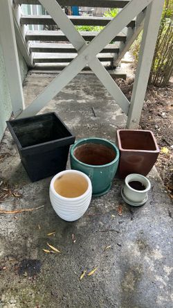 Four ceramic pots and one metal