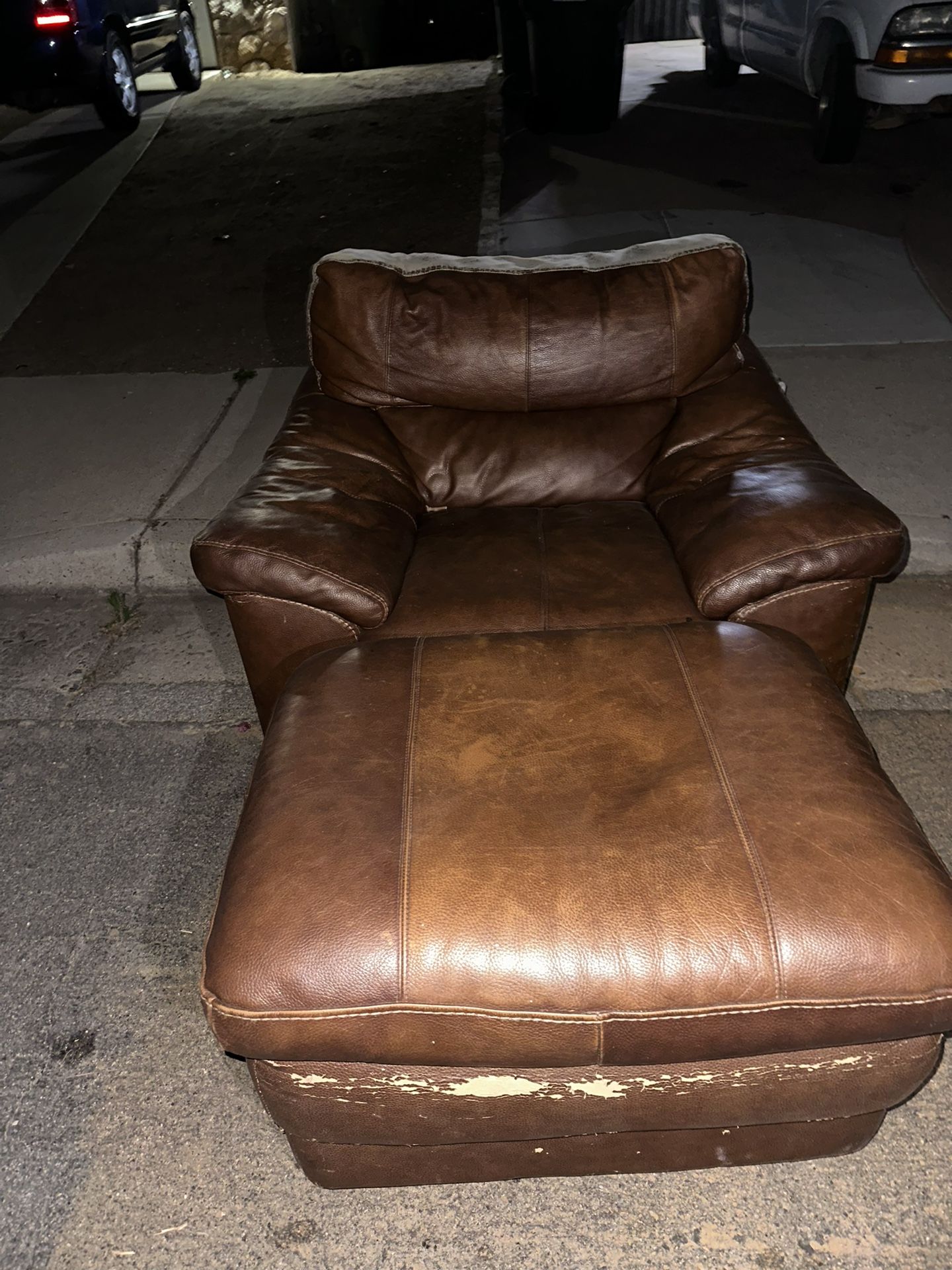 brown chair with a ottoman. 