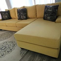 Like new! LIVING SPACES sectional sofa, only used for 6 months, large yellow, 2 pieces, 124" x 68", excellent condition! All covers are removable for 
