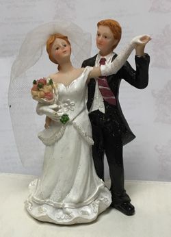 Cast bride and groom cake topper