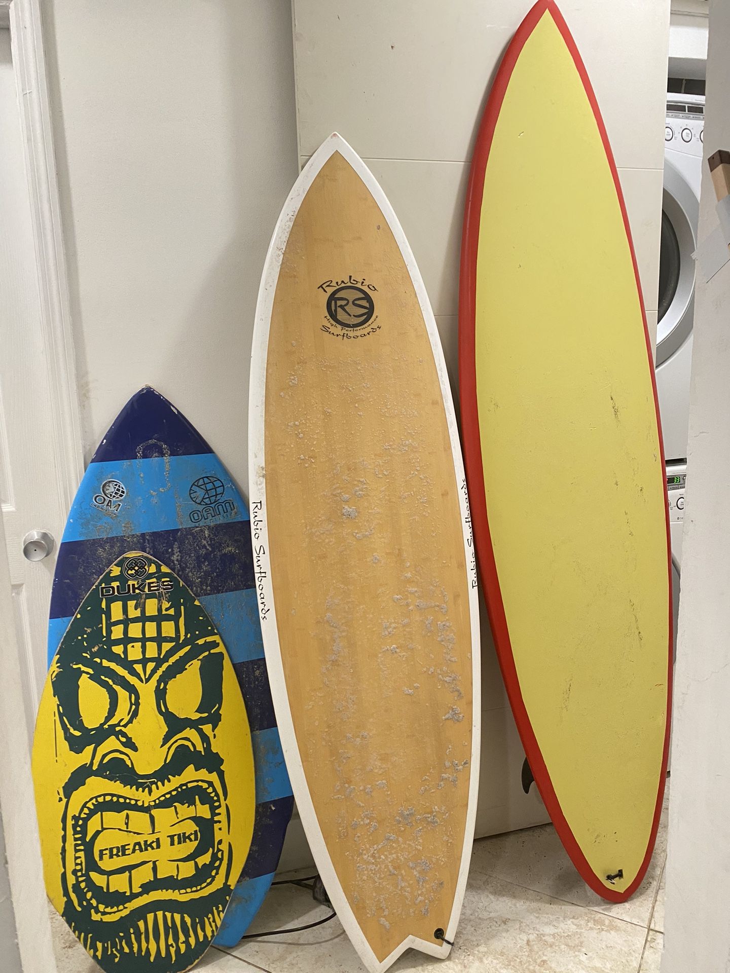 Two Surf Boards And Two Skim Boards 