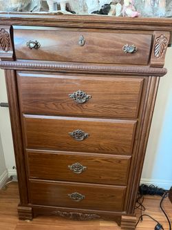 Ornate wood chest of drawers