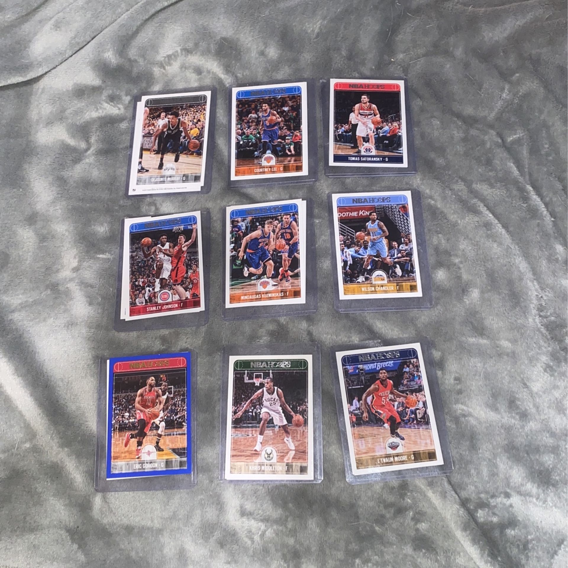An assortment of 18 2017 Panini NBA Hoops Basketball Cards. Great Deal Worth $65!