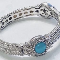 JUDITH RIPKA Turquoise CZ Diamonique STERLING Hinged CUFF BRACELET  This stunning cuff bracelet by Judith Ripka is an original piece with a beautiful 