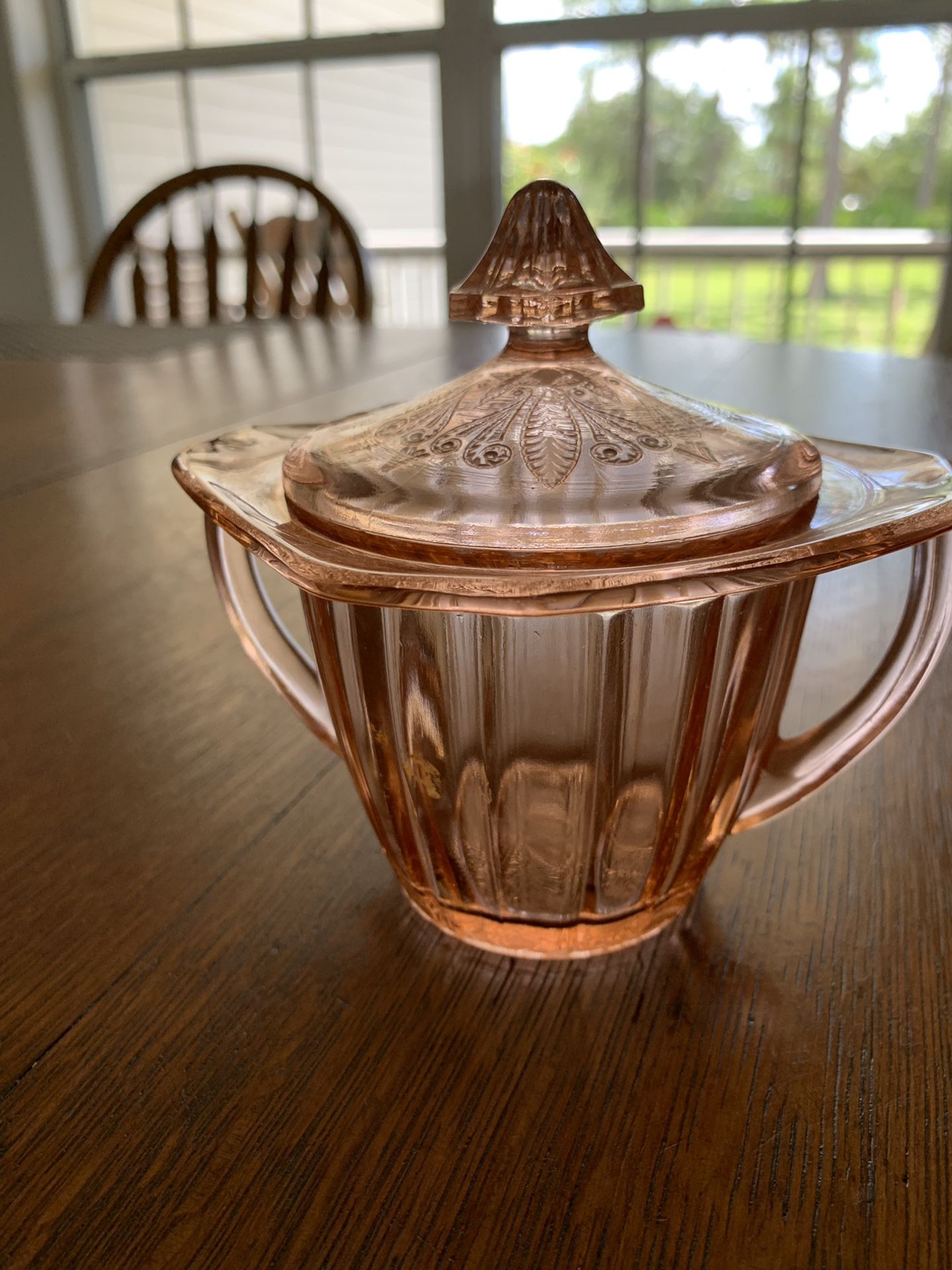 Pink depression glass covered sugar bowl