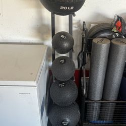 Five Medicine Balls With Rack
