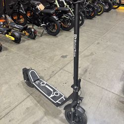 Electric scooter with shock absorption