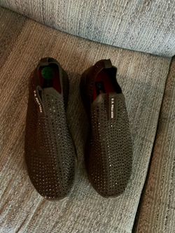 Black sneakers with black stones