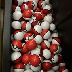 25. Poké Balls With 25 Random Action Figures Inside.