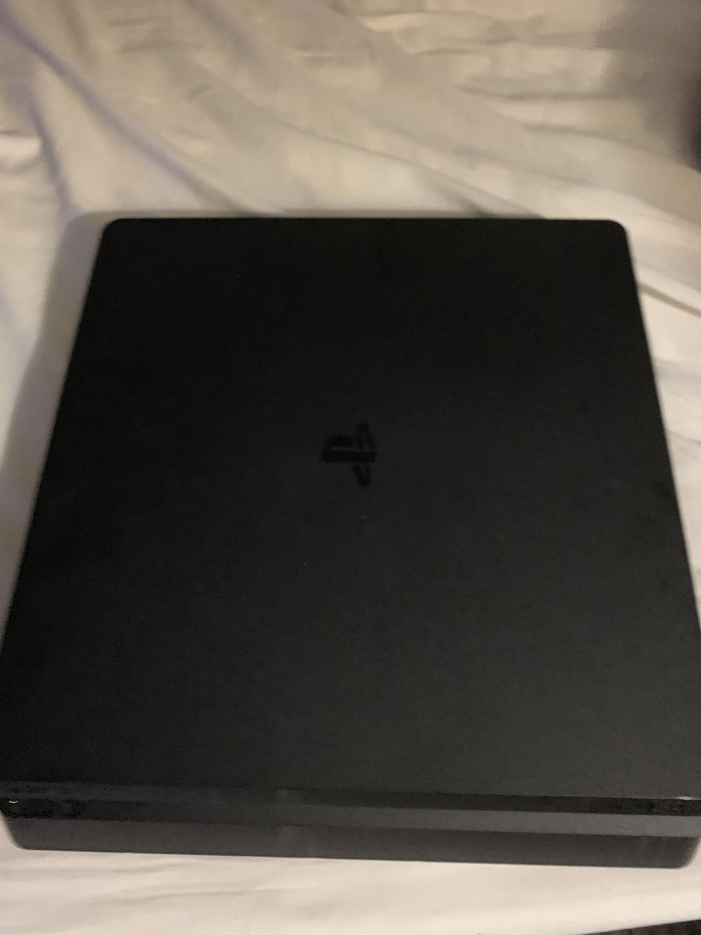 PS4 Slim with controller and cables