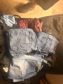LARGE SUITCASE OF MENS AND WOMENS CLOTHING