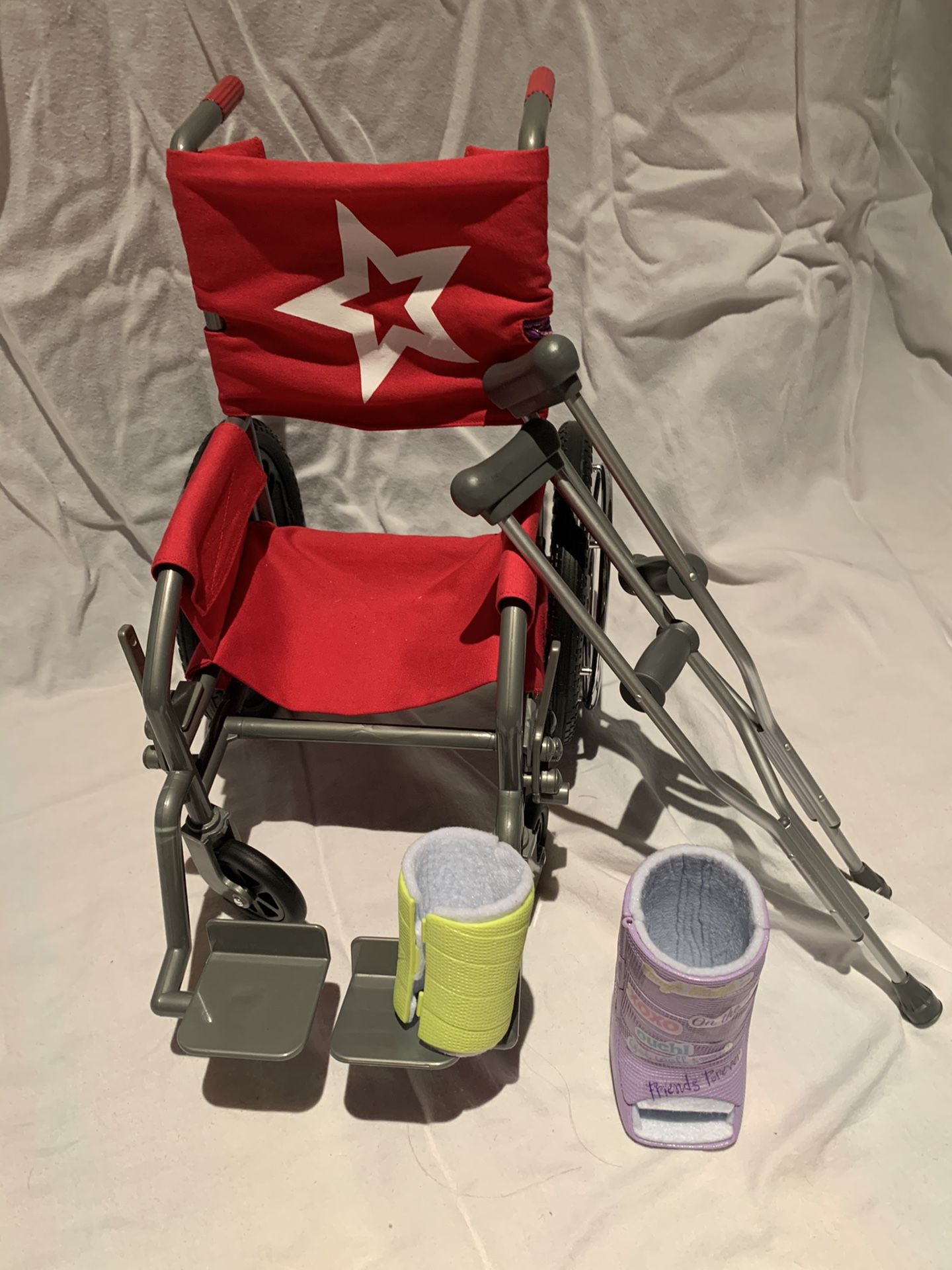 American girl - wheelchair, two casts and crutches