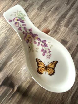 Lenox Butterfly Meadow Spoon Rest   Pretty ceramic spoon rest. Has a monarch butterfly and lovely purple flowers. Even a cute little ladybug on one of