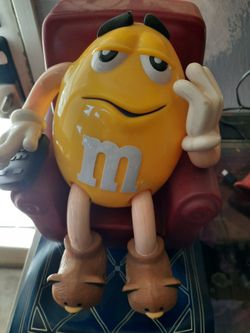 Yellow M&M candy dispenser