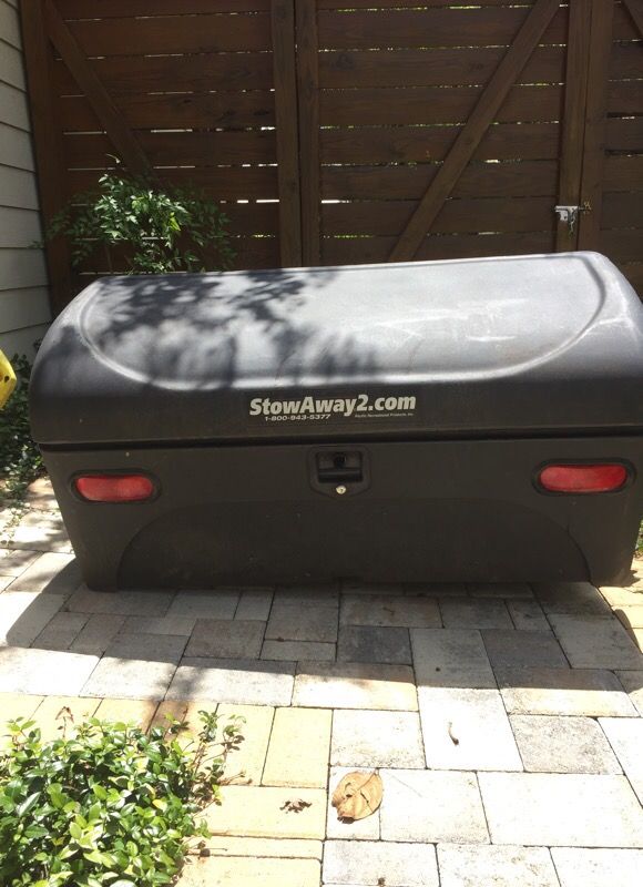 Stowaway2 swing away hitch mounted cargo carrier box.