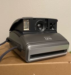 Vintage early 2000s Polaroid One 600 camera with strap, original packaging, and booklet