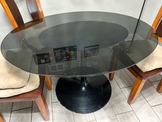 Marble type glass dining room table with base has weight to end Marble type glass dining room table with base has weight to end