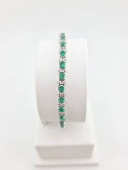 14k white gold emerald and natural diamond tennis bracelet