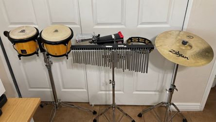 Percussion instruments: congas, cymbal, 2 calfs, 3 stands, tambourine, chimes