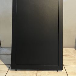 A frame chalkboard sign