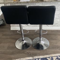 Two Black Pull Up Chairs