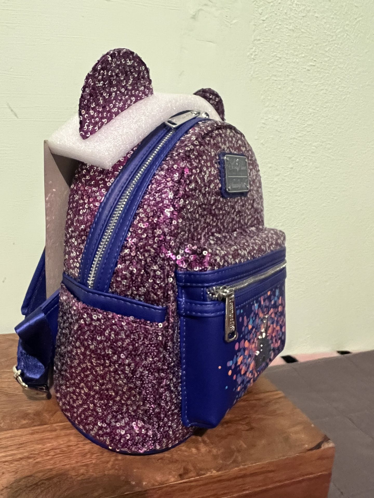 celebration loungefly mini backpack Star Wars Armorer Cosplay | Officially Licensed | Plastic/Vegan Leather Dazzling in opalescent sequins and a matching opalescent satin bow Loungefly Disney Mickey Mouse Fireworks