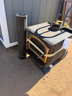 Wood burning stove with pipe