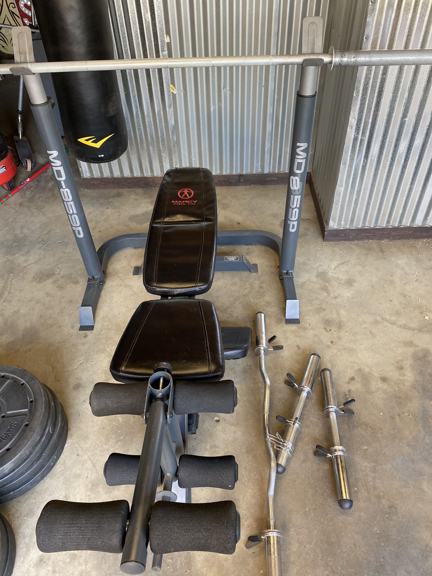 Marcy weight bench, bars, 35/25/10 plates in great shape!!