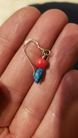 A pair of Silver and real turquoise stone
