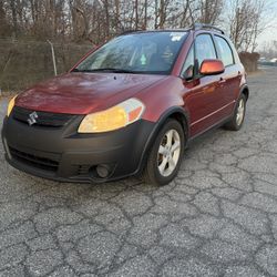 2009 Suzuki hatchback. Drives Great $2490 Is Cheap !