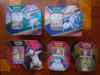 Pokemon tins with matching cards