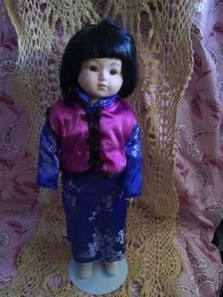 Cute oriental porcelain doll