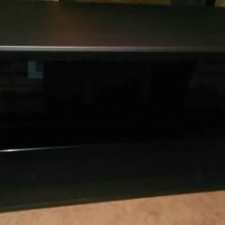 T.V Stand W/ Glass Shelf! Holds Up To A 65" T.V!