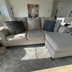 Ashley Reversible Sectional Couch (sold with 4 pillows) 