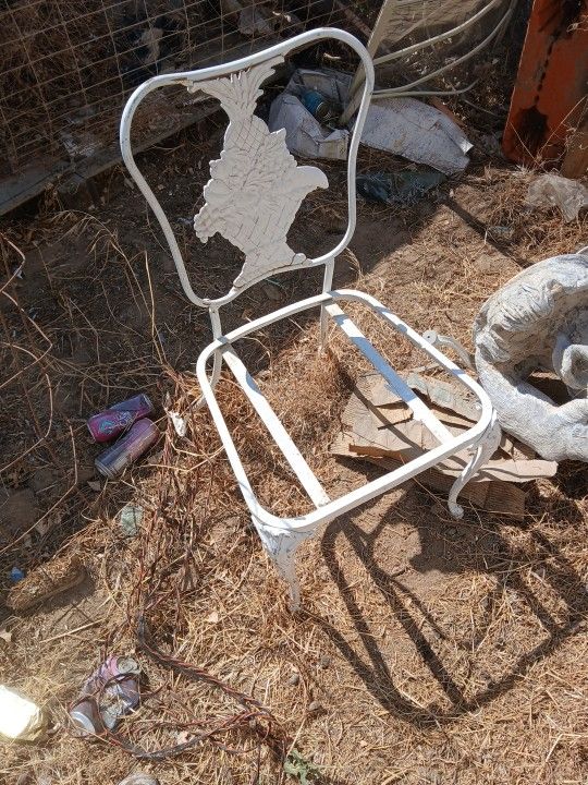 Two antique metal chairs
