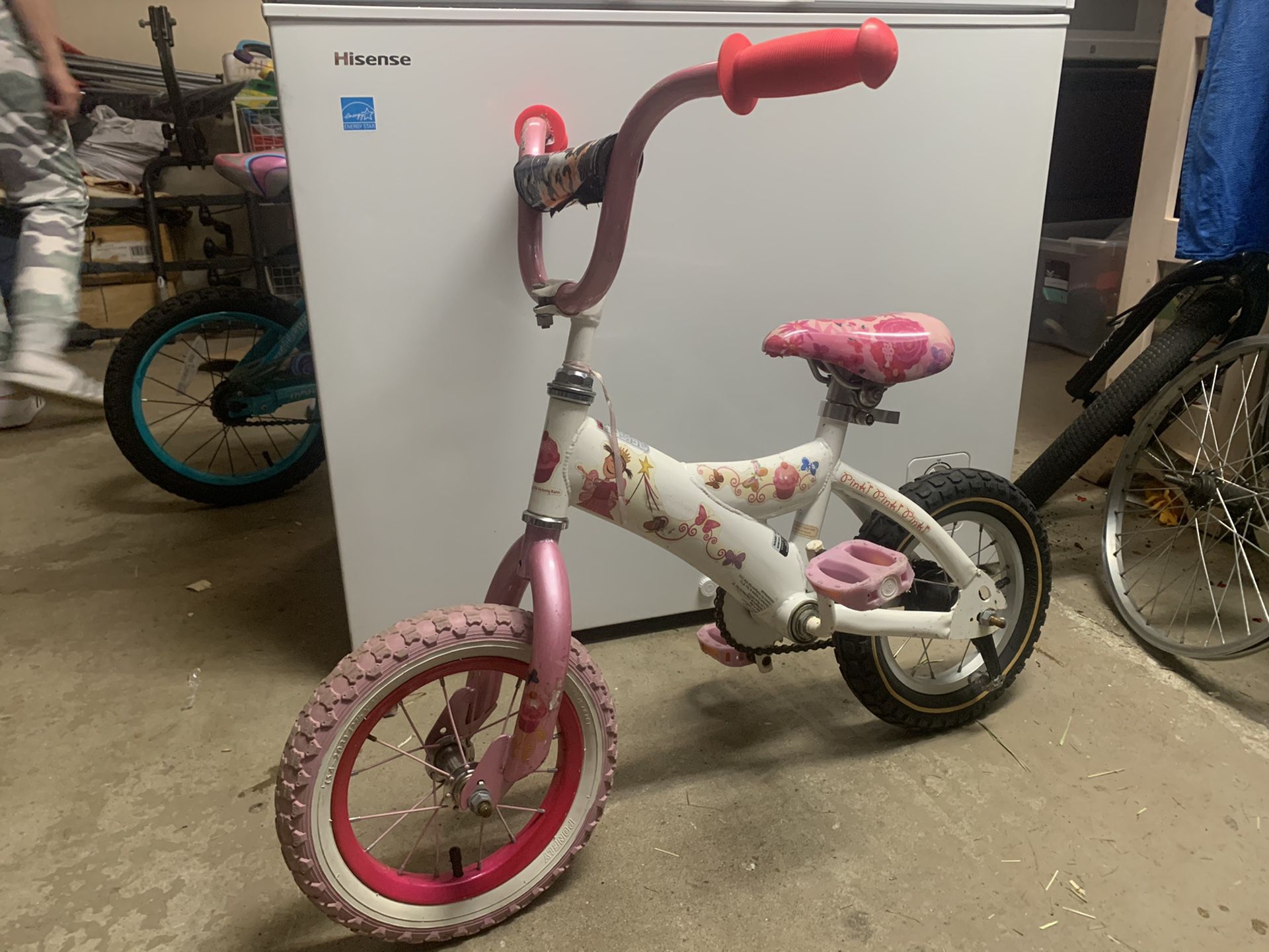 Very small girl pink and white bicycle mini bike