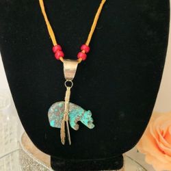 Vintage Native Zuni carved turquoise sterling bear feather pendant