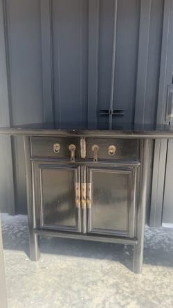 Black Asian-Style Wood Cabinet with Brass Hardware