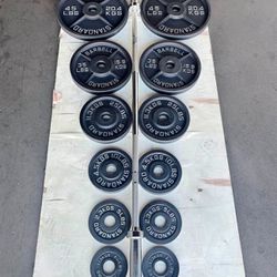 Olympic Cast Iron plates set. ( 285 lbs total) brand new in the box . Delivery Available For A Fee