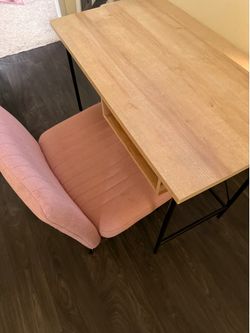Table and pink chair