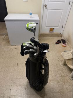 Leather golf bag and set of clubs