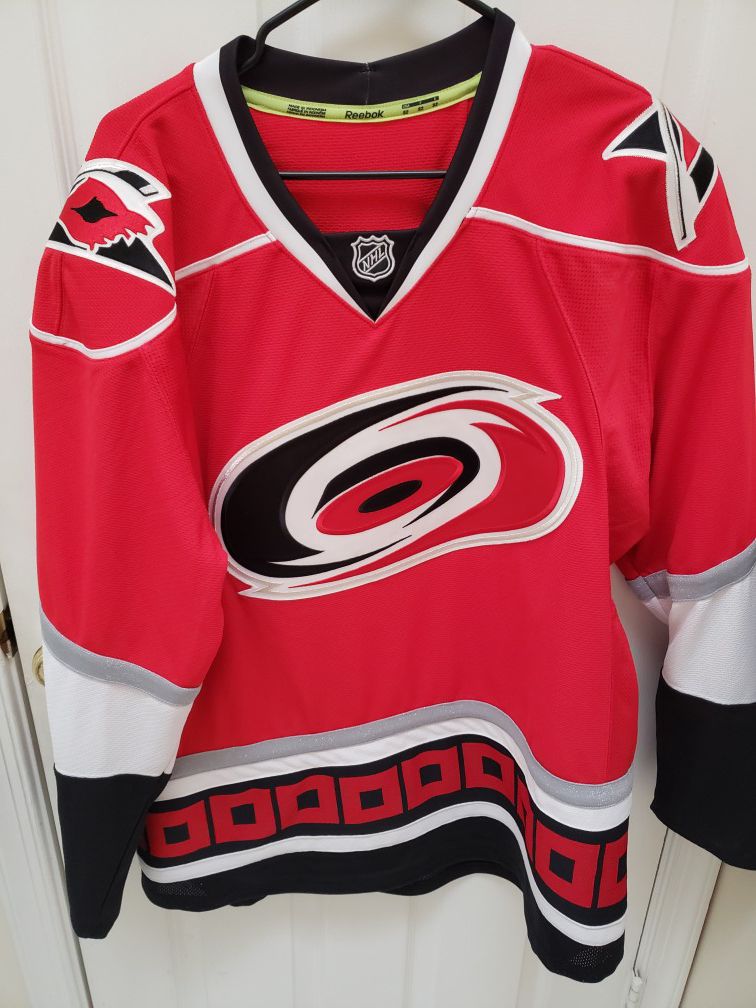 New never worn Carolina Hurricanes jersey size 52 by Reebok