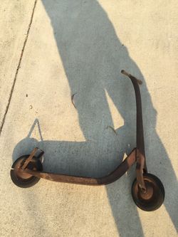 Vintage metal rubber wheels kids wood handled scooter.