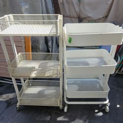 TWO 3 TIER SHELVES ON WHEELS