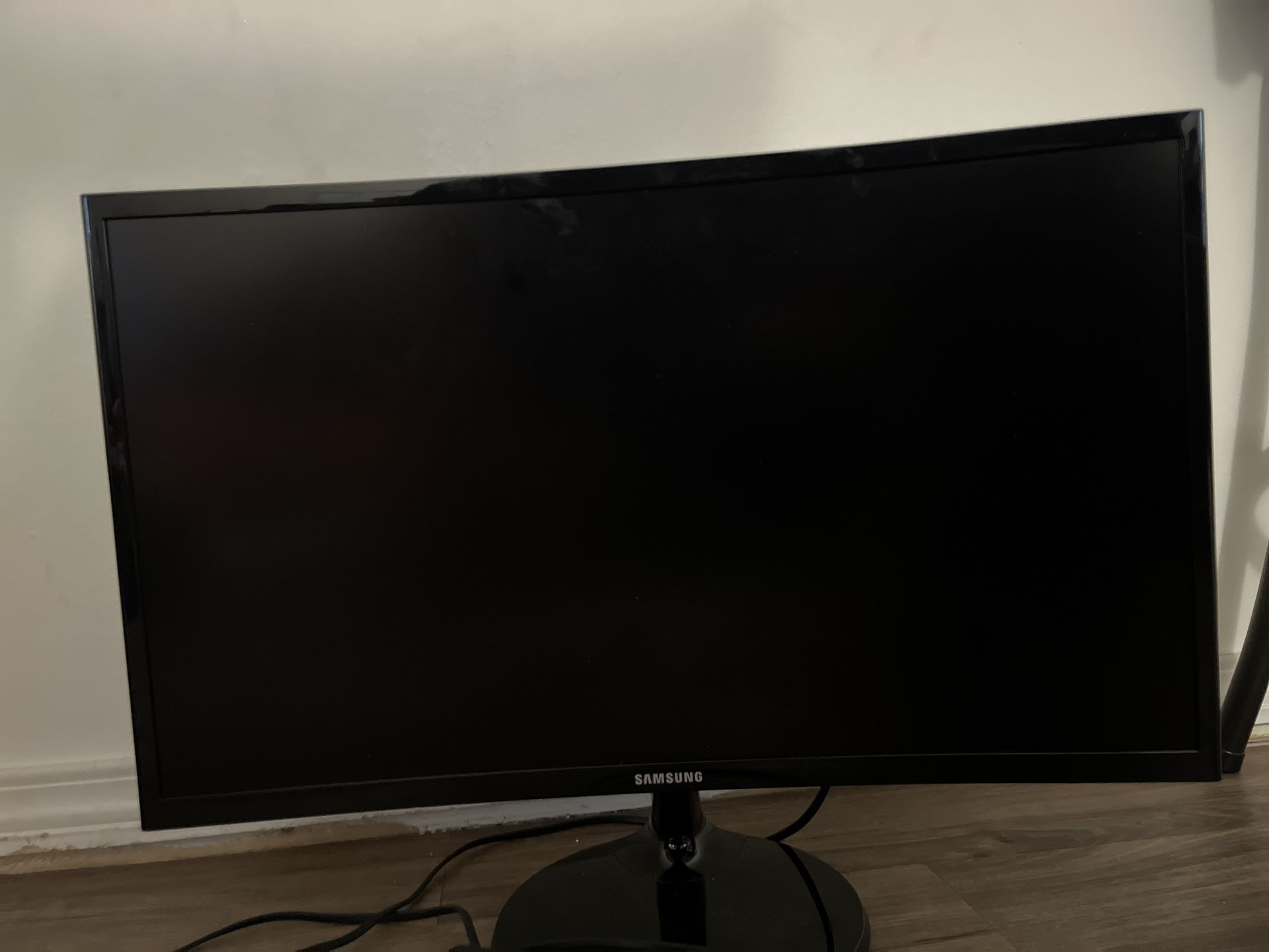 Black Samsung 24-inches curved monitor screen c24f390fhn