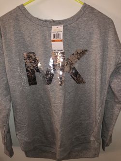 Michael Kors size small runs big